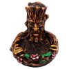 Handcrafted round incense holder ash tray with a floral design and a 3D figurine of a tree man in brown, black, gold, green, and multicolored color combination.
