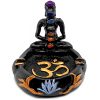 Handcrafted round incense holder ash tray with a gold om sign, lotus design, and a black 3D figurine of a meditating body with 7 chakra rainbow-colored tumbled gemstone crystals.