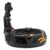 Handcrafted round incense holder ash tray with a gold om sign, lotus design, and a black 3D figurine of a meditating body with 7 chakra rainbow-colored tumbled gemstone crystals.