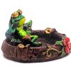 Handcrafted round incense holder ash tray with a floral design and 3D figurine of a chill frog relaxing with sunglasses in green, red, black, brown, and gold color combination.
