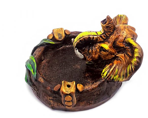 Handcrafted round incense holder ash tray with a leaf design and 3D figurine of an elephant head in yellow, beige, green, brown, black, and gold color combination.