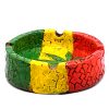Handcrafted round-shaped flat incense holder ash tray with Rasta-colored mosaic tile design and cannabis pot leaf in green, yellow, and red color combination.