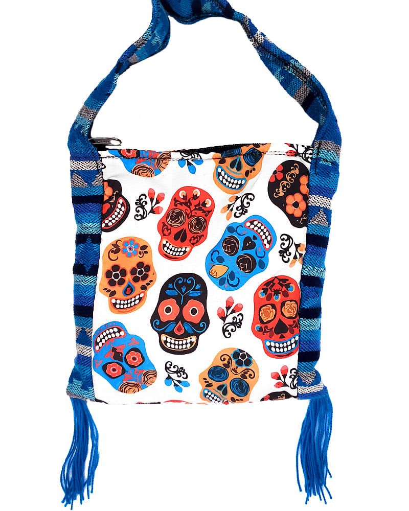 Handmade small square-shaped padded crossbody purse bag with woven tribal print striped pattern, multicolored floral Day of the Dead sugar skull design, and fringe in white, red, turquoise blue, golden yellow, and black color combination.