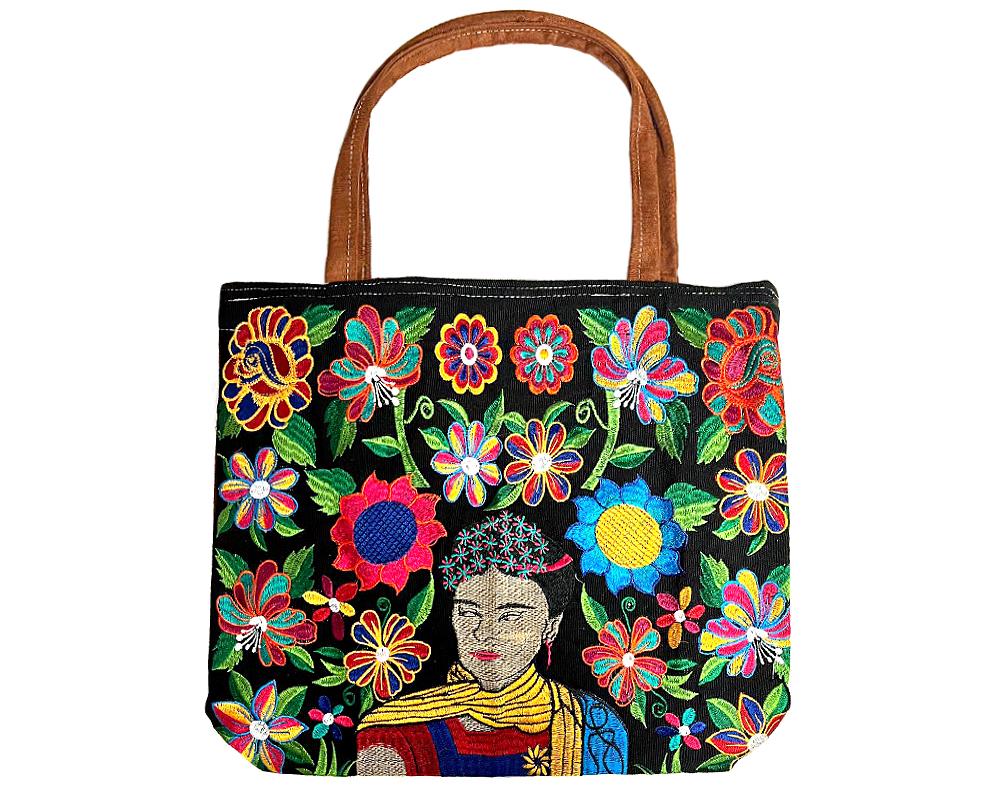 LB-020403990899 Handmade extra large tote purse bag with multicolored embroidered Frida inspired and floral designs and brown vegan leather suede handle in assorted colors. Color will vary from examples in image.