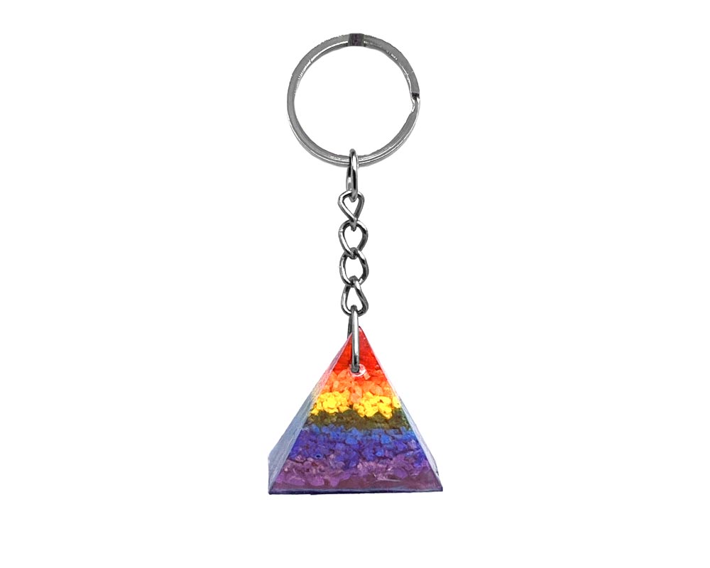 Handmade clear resin and crushed chip stone inlay orgonite pyramid keychain on silver metal keyring in 7 chakra striped rainbow colors.