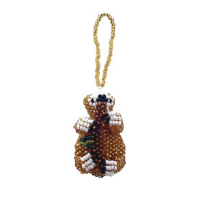 Handmade Czech glass seed bead animal figurine hanging ornament of a sloth in gold, brown, and white color combination.