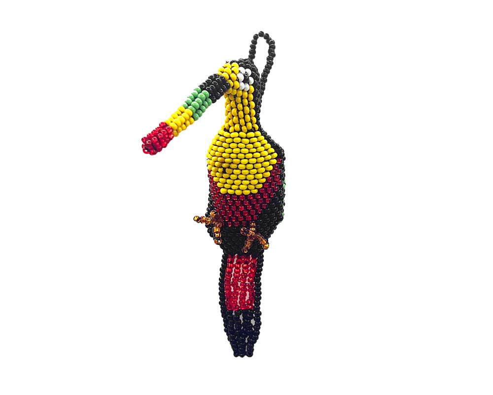Handmade Czech glass seed bead animal figurine hanging ornament of a toucan bird in black, yellow, red, and green color combination.