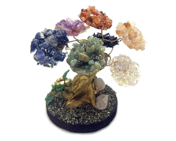 Handmade chip stone crystal tree of life table ornament with gold-colored trunk and crushed pyrite round stone base in 7 chakra rainbow color combination.