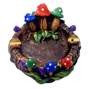 Handcrafted round incense holder ash tray with a 3D figurine of toadstool mushrooms and leaves in multicolored, white, brown, black, and gold color combination.