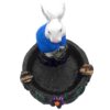 Handcrafted round incense holder ash tray with a flower and leaf design and 3D figurine of a rabbit holding money in turquoise, green, black, and gold color combination.